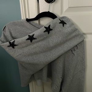 Cropped and distressed grey sweatshirt with 5 beaded black stars down each arm